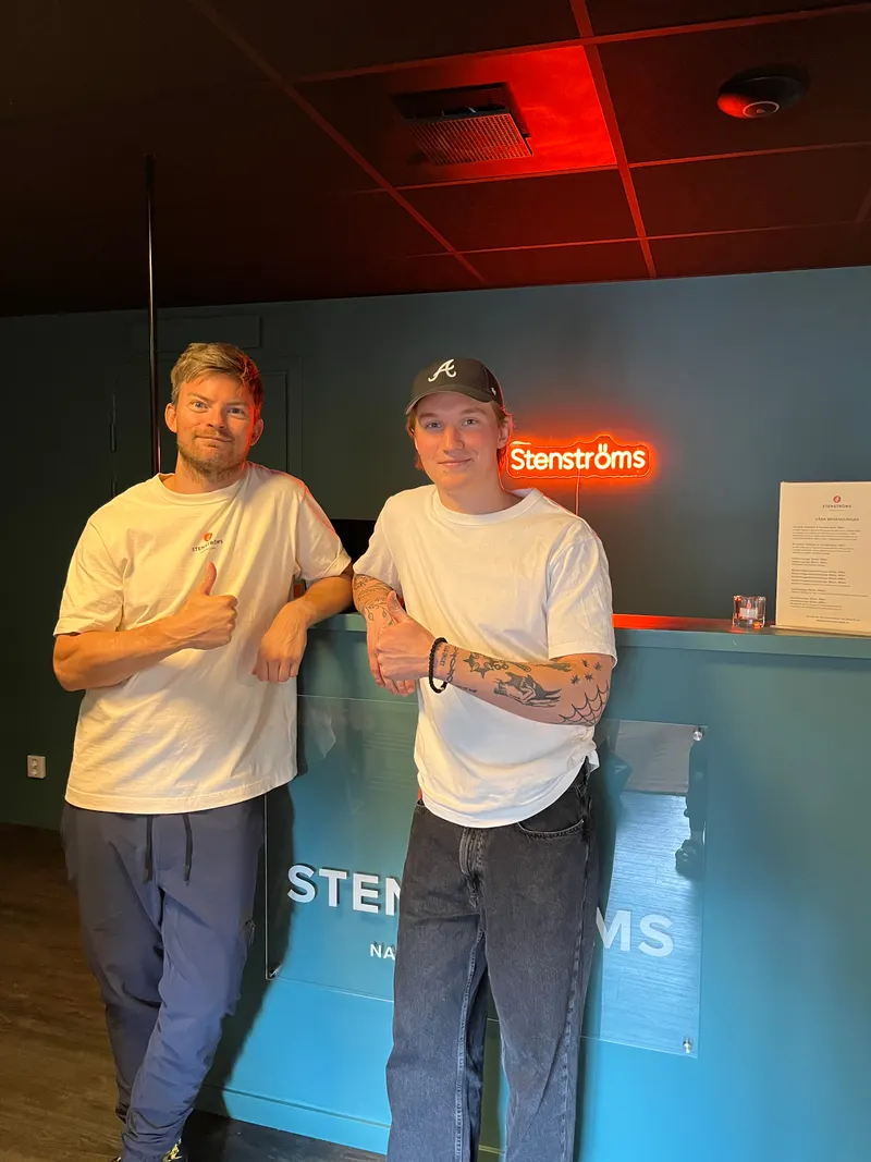 Two of the Glow team at a client clinic front desk